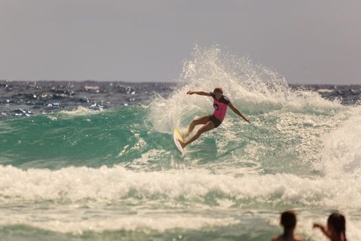 SNAPPER ROCKS, GOLD COAST, AUSTRALIA - 9 MARCH: Unidentified Surfer races the Quiksilver & Roxy Pro World Title Event. 9 March 2013, Snapper Rocks, Gold Coast, Australia