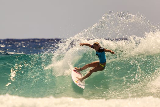 SNAPPER ROCKS, GOLD COAST, AUSTRALIA - 9 MARCH: Unidentified Surfer races the Quiksilver & Roxy Pro World Title Event. 9 March 2013, Snapper Rocks, Gold Coast, Australia