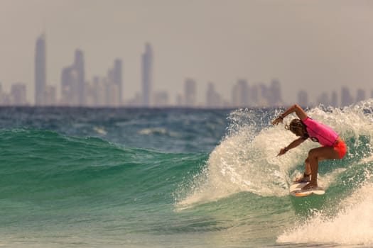 SNAPPER ROCKS, GOLD COAST, AUSTRALIA - 9 MARCH: Unidentified Surfer races the Quiksilver & Roxy Pro World Title Event. 9 March 2013, Snapper Rocks, Gold Coast, Australia