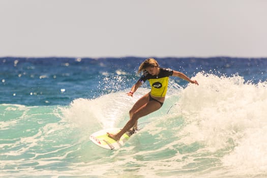 SNAPPER ROCKS, GOLD COAST, AUSTRALIA - 9 MARCH: Unidentified Surfer races the Quiksilver & Roxy Pro World Title Event. 9 March 2013, Snapper Rocks, Gold Coast, Australia