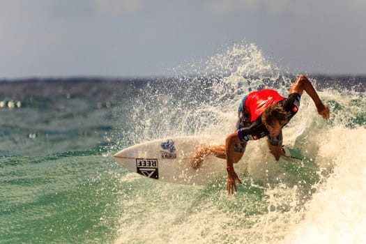 SNAPPER ROCKS, GOLD COAST, AUSTRALIA - 9 MARCH: Unidentified Surfer races the Quiksilver & Roxy Pro World Title Event. 9 March 2013, Snapper Rocks, Gold Coast, Australia