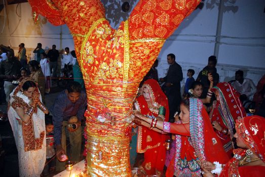 PAKISTAN, Karachi :  Married Hindu women pray at the Netty Jetty temple during the Karva Chauth festival in Karachi on October 30, 2015. Married women observe Karvachauth by fasting and offering prayers seeking welfare, prosperity, and longevity of their husbands.