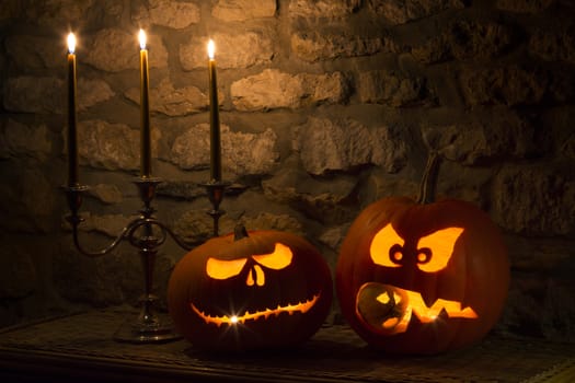 Spooky Halloween pumpkins - the night of 31st October, the eve of All Saints Day, often celebrated by children dressing up in frightening masks and costumes.