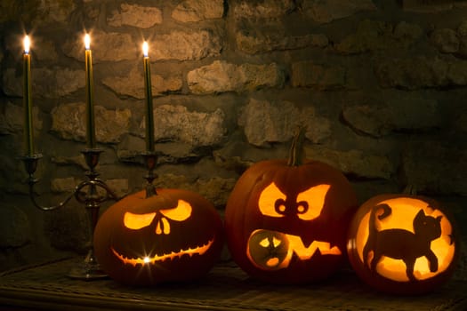 Spooky Halloween pumpkins - the night of 31st October, the eve of All Saints Day, often celebrated by children dressing up in frightening masks and costumes.