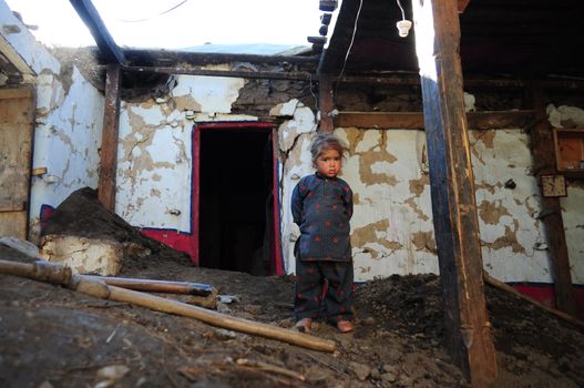 PAKISTAN, Tor Ghar: A Pakistani earthquake survivor looks on among the rubble of his damaged house in Tor Ghar near Sibi city, on October 28, 2015.  The powerful 7.5-magnitude earthquake that struck on October 26 ripped across Afghanistan and Pakistan, killing nearly 390 people and levelling thousands of homes, forcing many to camp out in the open. The army has led the rescue effort in Pakistan while the government has promised aid and compensation, but with many of the affected communities isolated by rugged terrain, help may not arrive before the snow does. 