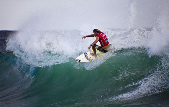 SNAPPER ROCKS, GOLD COAST, AUSTRALIA - FEB 26: Unidentified Surfer races the Quiksilver & Roxy Pro World Title Event. February 26, 2012, Snapper Rocks, Gold Coast, Australia