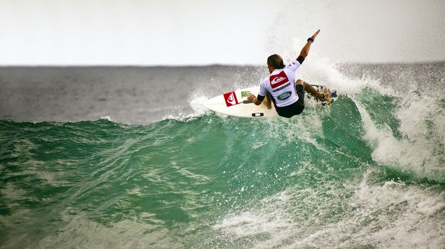 SNAPPER ROCKS, GOLD COAST, AUSTRALIA - FEB 26: Unidentified Surfer races the Quiksilver & Roxy Pro World Title Event. February 26, 2012, Snapper Rocks, Gold Coast, Australia