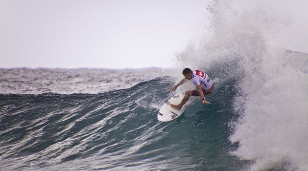 SNAPPER ROCKS, GOLD COAST, AUSTRALIA - FEB 26: Unidentified Surfer races the Quiksilver & Roxy Pro World Title Event. February 26, 2012, Snapper Rocks, Gold Coast, Australia