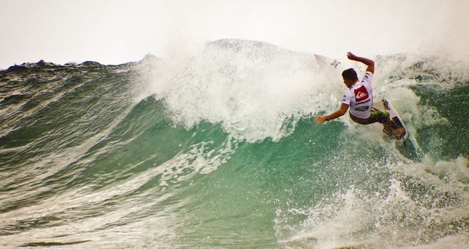 SNAPPER ROCKS, GOLD COAST, AUSTRALIA - FEB 26: Unidentified Surfer races the Quiksilver & Roxy Pro World Title Event. February 26, 2012, Snapper Rocks, Gold Coast, Australia