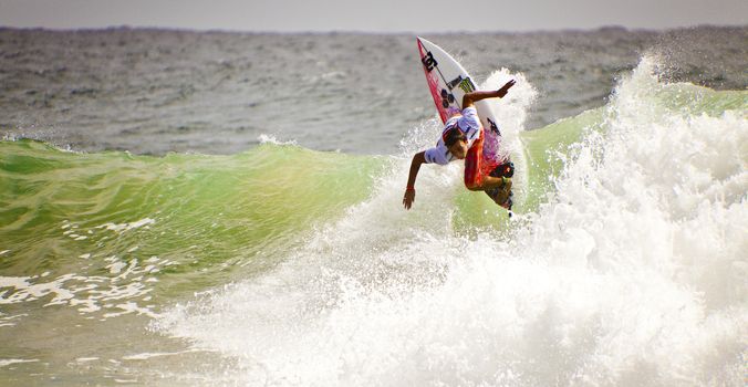 SNAPPER ROCKS, GOLD COAST, AUSTRALIA - FEB 26: Unidentified Surfer races the Quiksilver & Roxy Pro World Title Event. February 26, 2012, Snapper Rocks, Gold Coast, Australia