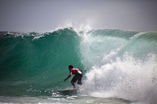 SNAPPER ROCKS, GOLD COAST, AUSTRALIA - FEB 26: Unidentified Surfer races the Quiksilver & Roxy Pro World Title Event. February 26, 2012, Snapper Rocks, Gold Coast, Australia