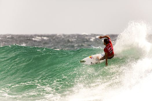 SNAPPER ROCKS, GOLD COAST, AUSTRALIA - FEB 26: Unidentified Surfer races the Quiksilver & Roxy Pro World Title Event. February 26, 2012, Snapper Rocks, Gold Coast, Australia