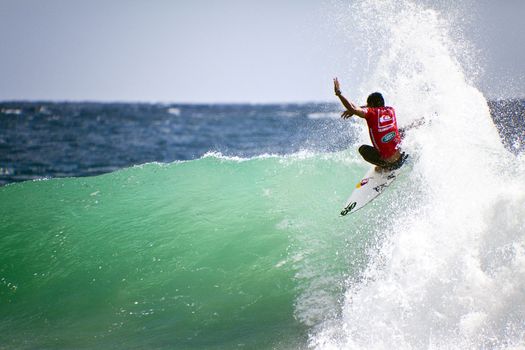 SNAPPER ROCKS, GOLD COAST, AUSTRALIA - FEB 26: Unidentified Surfer races the Quiksilver & Roxy Pro World Title Event. February 26, 2012, Snapper Rocks, Gold Coast, Australia