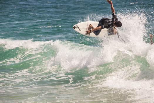 SNAPPER ROCKS, GOLD COAST, AUSTRALIA - FEB 26: Unidentified Surfer races the Quiksilver & Roxy Pro World Title Event. February 26, 2012, Snapper Rocks, Gold Coast, Australia