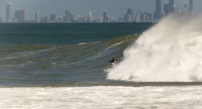 SNAPPER ROCKS, GOLD COAST, AUSTRALIA - FEB 26: Unidentified Surfer races the Quiksilver & Roxy Pro World Title Event. February 26, 2012, Snapper Rocks, Gold Coast, Australia