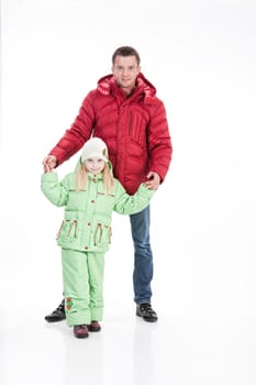 Young man and girl in winter clothing on isolated studio baclground