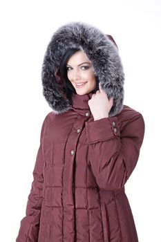 Young attractive woman in fashionable clothing on isolated background