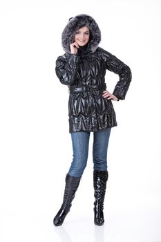 Young attractive woman in fashionable clothing on isolated background