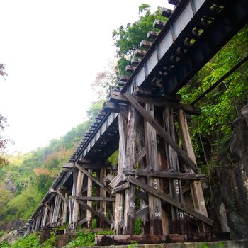 old wood structure of dead railways bridge important landmark and destination of world war II history in kanchanaburi thailand and now is famous visiting point of visitor in thailand