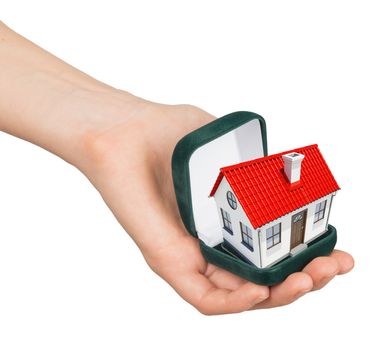 Empty ring box house in humans hand on isolated white background