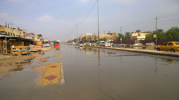  IRAQ, Baghdad : A street of Baghdad, Iraq, under the water after heavy rains on October 29, 2015, resulting a major flooding. According to a spokesman for the meteorological department, more than 2 inches of rain fell on the city in 24 hours. Some motorists were forced to leave their cars when they became stuck in deep water.  	
