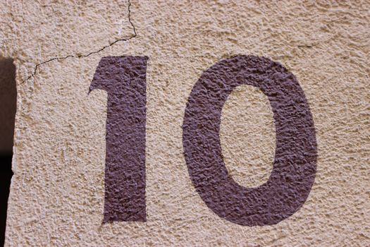 Number 10 painted on the wall of a house in France