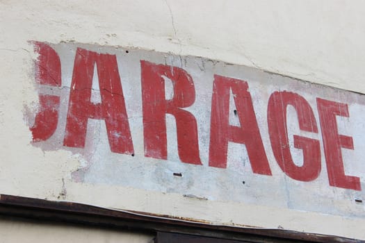 Vintage Sign with the word Garage on the wall in France