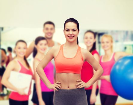 fitness and diet concept - smiling teenage girl in sportswear