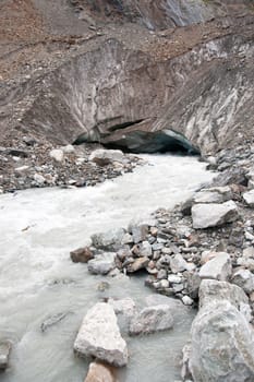 River stream from a glacier in mountain hiking attraction