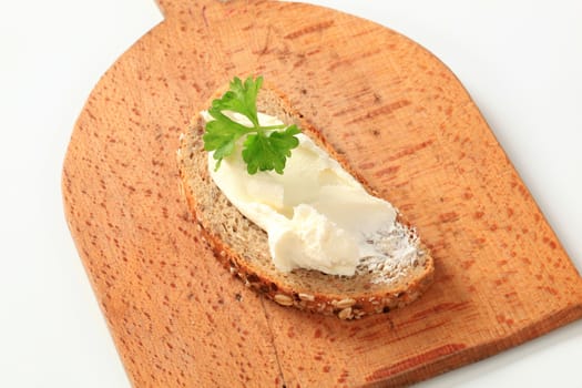Slice of bread and cheese spread - studio