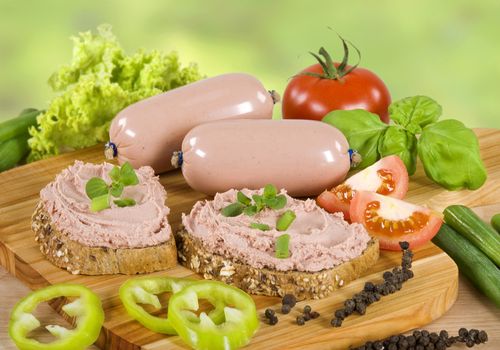 Slices of brown bread and liver pate 

