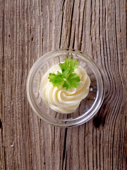 Swirl of fresh butter in a glass dish