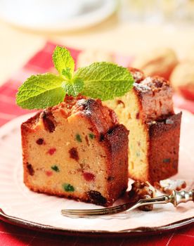 Two pieces of fruit cake on plate