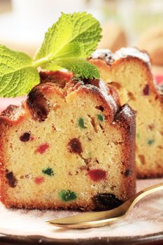 Two pieces of fruit cake on plate