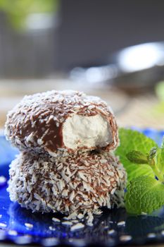 Chocolate coconut confections filled with cream