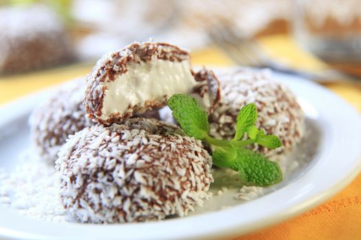 Chocolate coconut confections filled with cream