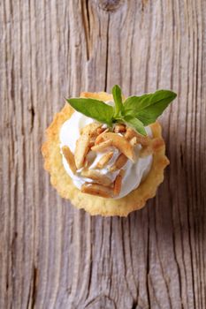 Canape - Pastry base with savory spread topping and roasted almonds