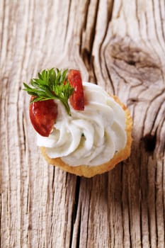 Canape - Pastry base with savory spread topping and salami