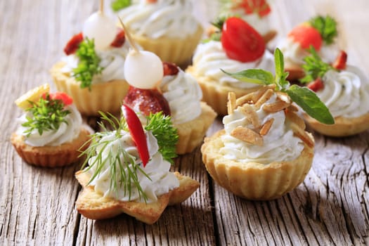 Variety of pastry-based canapes with various toppings