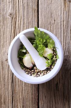 Mortar and pestle with ingredients ready to be ground