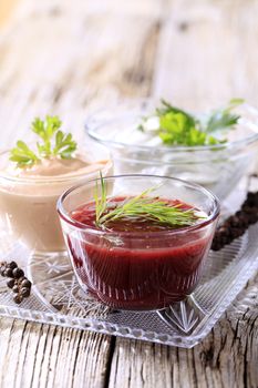 Selection of three dipping sauces on a tray