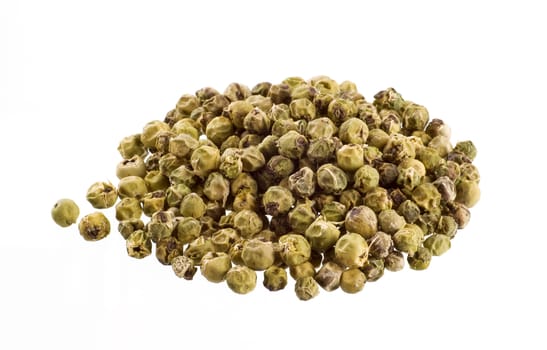 Heap of green peppercorns on white background