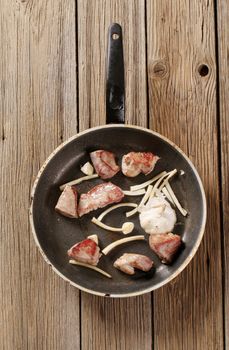 Chunks of pan fried pork  and garlic 