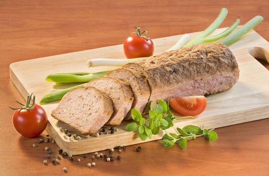 Slices of meatloaf on a cutting board
