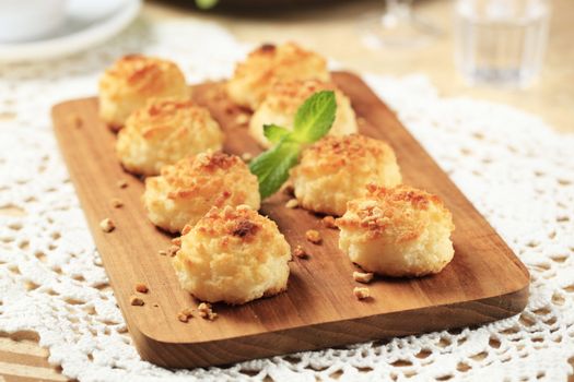 Coconut macaroons sprinkled with chopped nuts