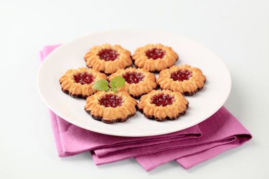 Chocolate dipped butter cookies with jam center