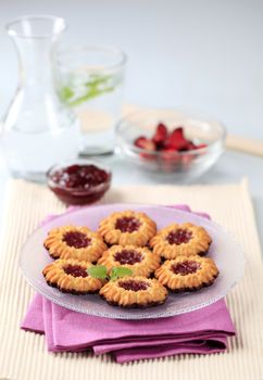 Chocolate dipped butter cookies with jam centers