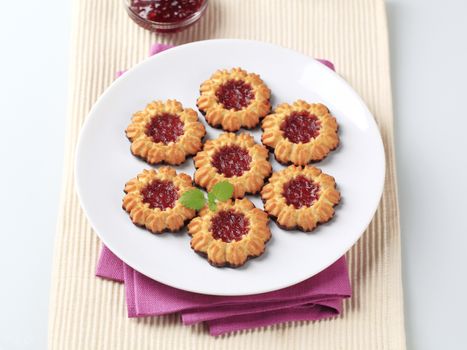 Chocolate dipped butter cookies with jam center