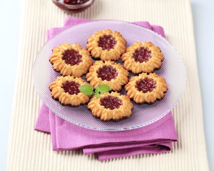 Chocolate dipped butter cookies with jam center