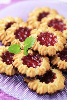 Chocolate dipped butter cookies with jelly center